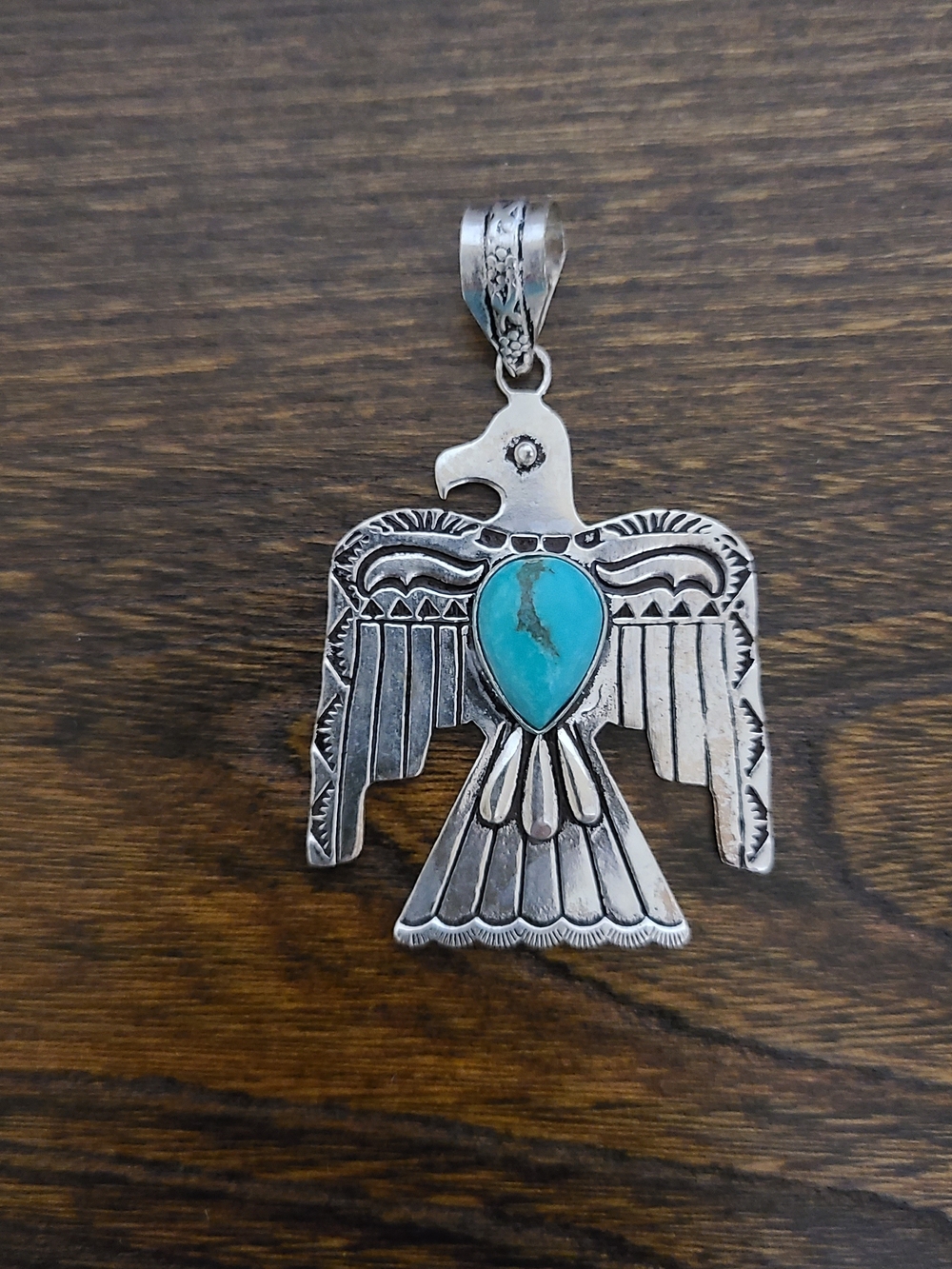 Sterling Silver Thunderbird Pendant with Turquoise Stone